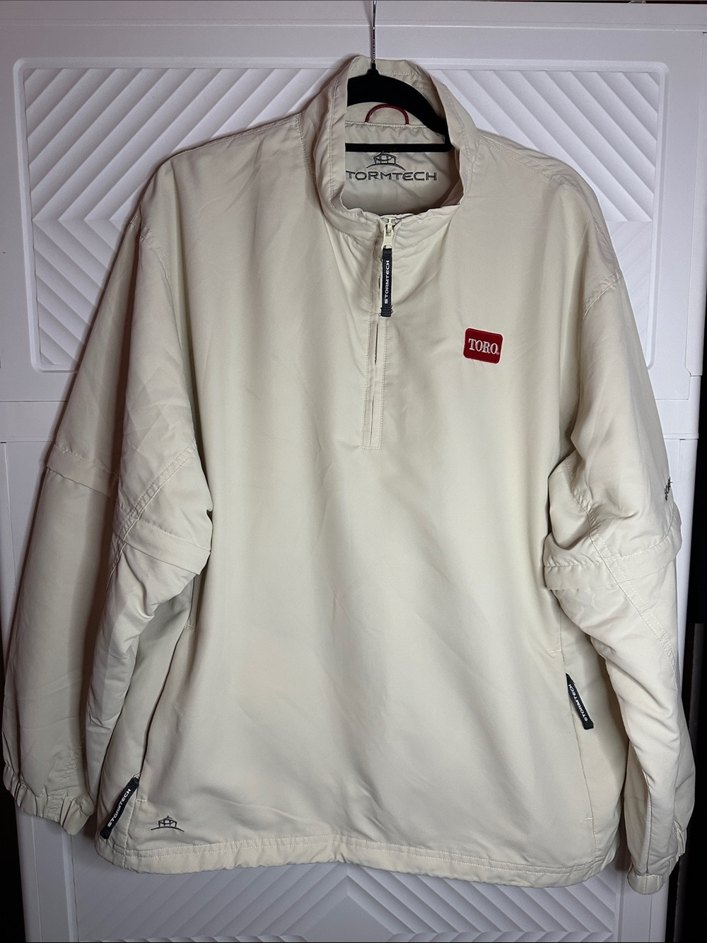 StormTech Cream Half-Zip Windbreaker with Toro Patch